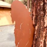 Bigfoot Leaning on Tree